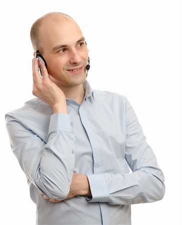 simsearch:400-06108986,k - handsome customer service operator wearing a headset isolated on white background Stock Photo - Budget Royalty-Free & Subscription, Code: 400-06108986