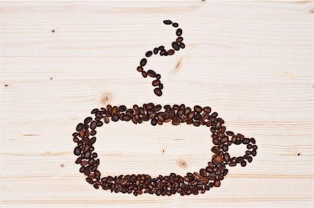 Coffee beans isolated on natural wood, background. Photographie de stock - Aubaine LD & Abonnement, Code: 400-06109111