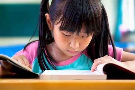 little girl studying in classroom at school Stock Photo - Budget Royalty-Free & Subscription, Code: 400-06100217
