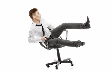 falling down in the office - Image of a young man rolling on chiar Stock Photo - Budget Royalty-Free & Subscription, Code: 400-06100476