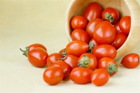 small cherry tomatoes in a wooden bowl Stock Photo - Budget Royalty-Free & Subscription, Code: 400-06100493