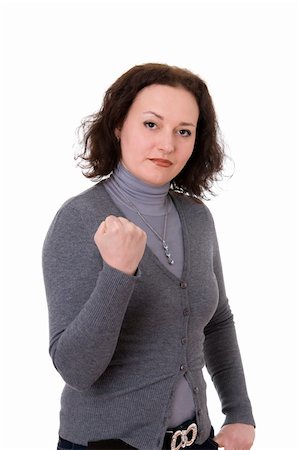 mid adult woman shows the fist  isolated on white background Fotografie stock - Microstock e Abbonamento, Codice: 400-06100541