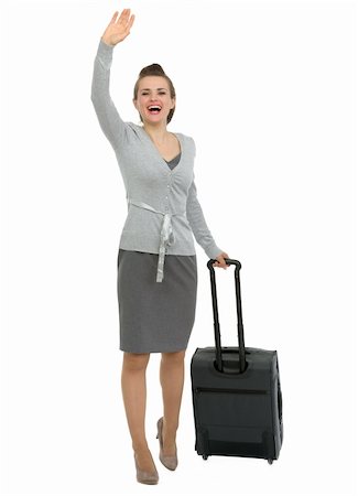 Excited traveling woman with suitcase waving hand Stock Photo - Budget Royalty-Free & Subscription, Code: 400-06100560