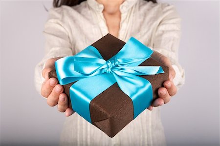 woman detail with a gift box in her hands Stock Photo - Budget Royalty-Free & Subscription, Code: 400-06100876