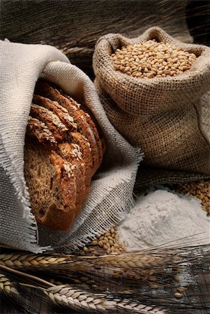 sack flour - Bread and wheat ears on vintage wooden board Stock Photo - Budget Royalty-Free & Subscription, Code: 400-06101360