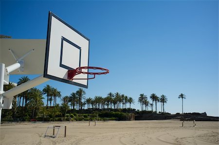 rim sand - Basketball hoop with other sports equipment in the background Stock Photo - Budget Royalty-Free & Subscription, Code: 400-06101454