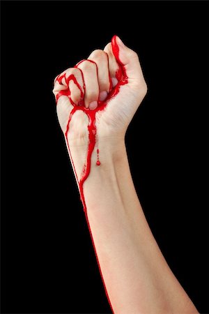 simsearch:400-05062045,k - A red paint soaked hand making a fist isolated on black. Fotografie stock - Microstock e Abbonamento, Codice: 400-06101542