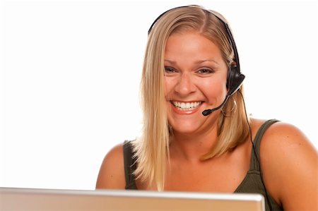 simsearch:400-05098432,k - Beautiful Friendly Female Customer Support Phone Operator in Front of a Computer Screen Isolated on a White Background. Photographie de stock - Aubaine LD & Abonnement, Code: 400-06101647