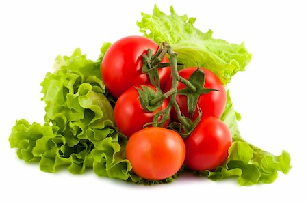 simsearch:400-05292254,k - Branch of ripe tomatoes on green salad leaves isolated on white background Photographie de stock - Aubaine LD & Abonnement, Code: 400-06101750