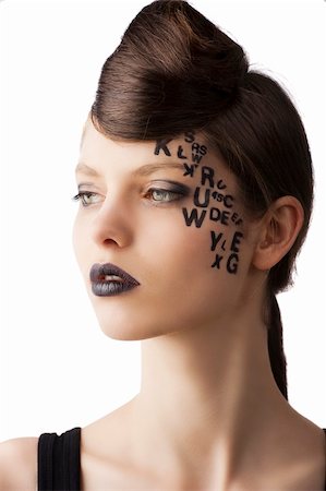 simsearch:400-04420197,k - very cute young girl with letter and number painted on her face and a nice creative hair style, she is turned of three quarters at right and looks in front of her Stock Photo - Budget Royalty-Free & Subscription, Code: 400-06101803