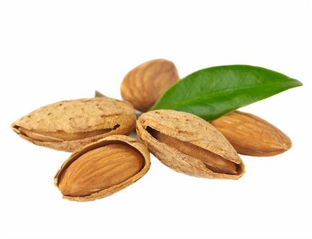 Almond with leaves on a white background Stock Photo - Budget Royalty-Free & Subscription, Code: 400-06101919