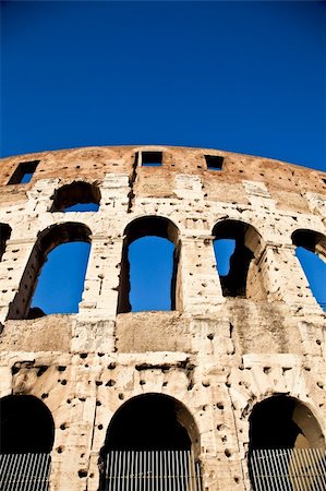 round amphitheatre - Colosseum in Rome with blue sky, landmark of the city Stock Photo - Budget Royalty-Free & Subscription, Code: 400-06102057
