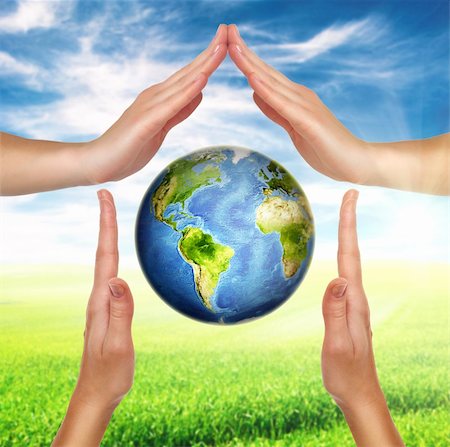 environmental safety business - house made of female hands with planet earth globe inside Stock Photo - Budget Royalty-Free & Subscription, Code: 400-06102686