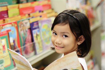 Happy asian girl in the library. Stock Photo - Budget Royalty-Free & Subscription, Code: 400-06102716