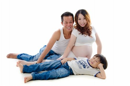 pregnant black women white man - Asian family portrait sitting on floor Stock Photo - Budget Royalty-Free & Subscription, Code: 400-06103375