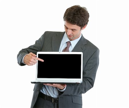 Modern businessman pointing in laptop Stock Photo - Budget Royalty-Free & Subscription, Code: 400-06103639