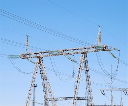 electric connection hazard - Power lines on the blue sky background Stock Photo - Budget Royalty-Free & Subscription, Code: 400-06103754