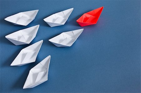 paper boat - White paper boats and one red boat. Stock Photo - Budget Royalty-Free & Subscription, Code: 400-06103866