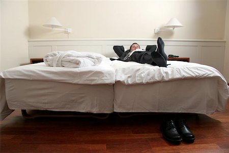 sleeping man foot - hard days work Photographie de stock - Aubaine LD & Abonnement, Code: 400-06126135