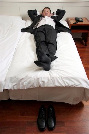 sleeping man foot - hotelroom, resting Photographie de stock - Aubaine LD & Abonnement, Code: 400-06126136