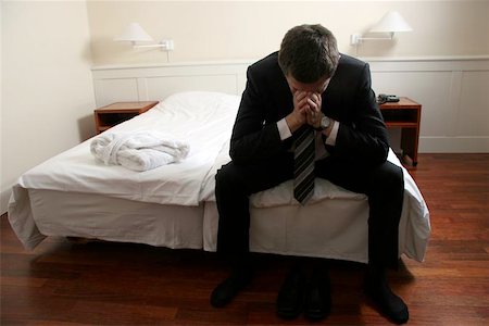 sleeping man foot - exhausted overworked man in hotel room Photographie de stock - Aubaine LD & Abonnement, Code: 400-06126140