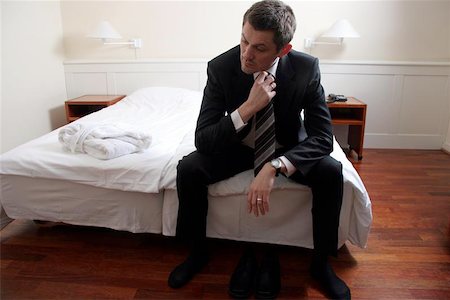 sitting on edge of bed Stock Photo - Budget Royalty-Free & Subscription, Code: 400-06126141