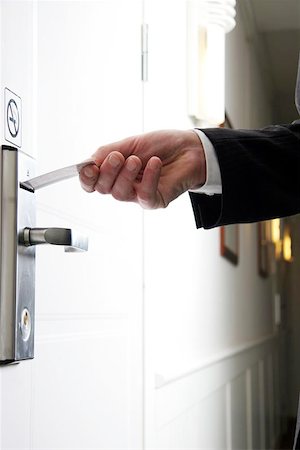 door handle with hand - arrival3 Stock Photo - Budget Royalty-Free & Subscription, Code: 400-06126219