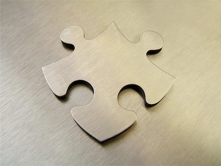 Steel jigsaw on a metallic background Stock Photo - Budget Royalty-Free & Subscription, Code: 400-06126755