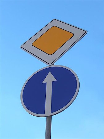 simsearch:400-08285445,k - A road sign pole with signs meaning Forward Only and Main Road Stockbilder - Microstock & Abonnement, Bildnummer: 400-06126951