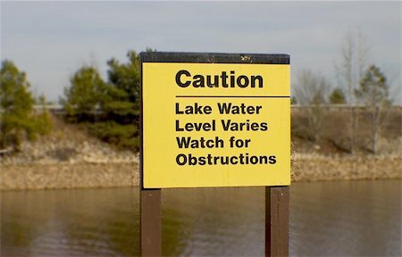 simsearch:400-05317345,k - Caution sign at lake to warn boaters Photographie de stock - Aubaine LD & Abonnement, Code: 400-06127227