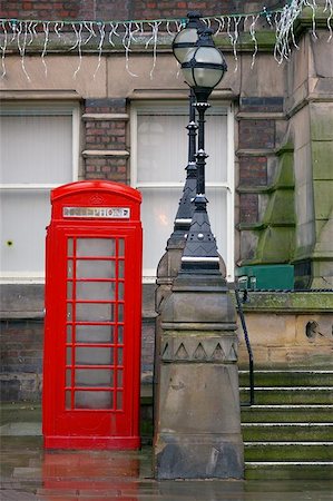 red call box - A public telephone box in the rain outside St. Helens Town Hall, Merseyside at Xmas time. Stock Photo - Budget Royalty-Free & Subscription, Code: 400-06127376