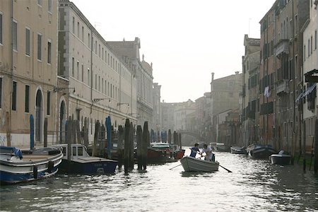 rowing a boat in venice - Wide canal in venice with boat in foreground Stock Photo - Budget Royalty-Free & Subscription, Code: 400-06128013
