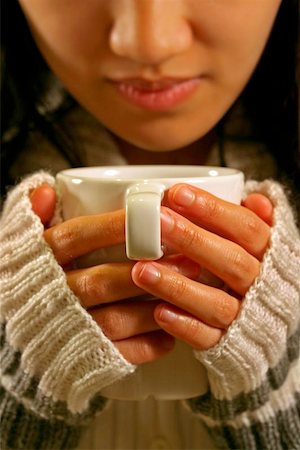 drinking chocolate - A woman holding a cup of coffee Stock Photo - Budget Royalty-Free & Subscription, Code: 400-06128357