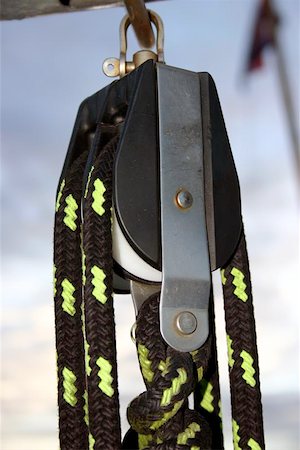 seriousfun (artist) - a sailing block hanging from the boom. Fotografie stock - Microstock e Abbonamento, Codice: 400-06128812