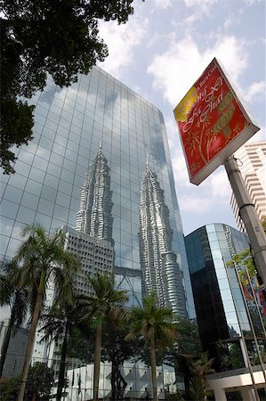 Reflection of Petronas Towers, Kuala Lumpur, Malaysia with Chinese New Year sign Stock Photo - Budget Royalty-Free & Subscription, Code: 400-06128889