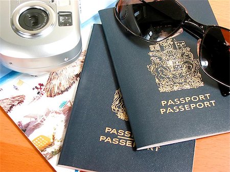 simsearch:400-09186100,k - Travel necessities: sunglasses, passports, camera Stock Photo - Budget Royalty-Free & Subscription, Code: 400-06129705