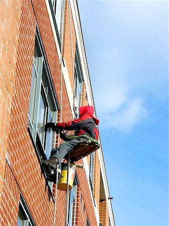 simsearch:400-04949609,k - Window washer working on a building wall Stock Photo - Budget Royalty-Free & Subscription, Code: 400-06129890