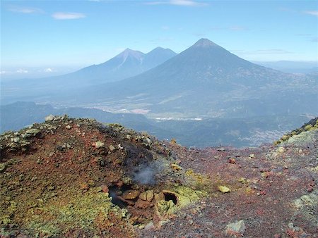 Volcanos of Guatemala viewed from the smoking sulphur coated vents of Pacaya. November 2005 Stock Photo - Budget Royalty-Free & Subscription, Code: 400-06134153