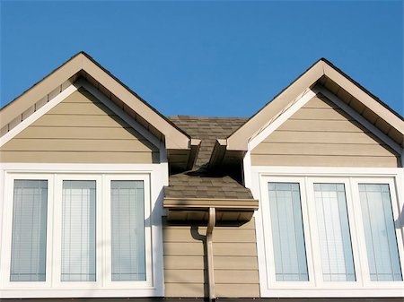 dormir - Detail of a brand new house on a bright blue sky background Stock Photo - Budget Royalty-Free & Subscription, Code: 400-06134164