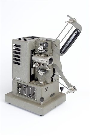 filmproduzent (männlich und weiblich) - A very old projector Stockbilder - Microstock & Abonnement, Bildnummer: 400-06134381