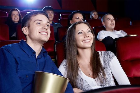 Smiling people in the cinema Stock Photo - Budget Royalty-Free & Subscription, Code: 400-06135477