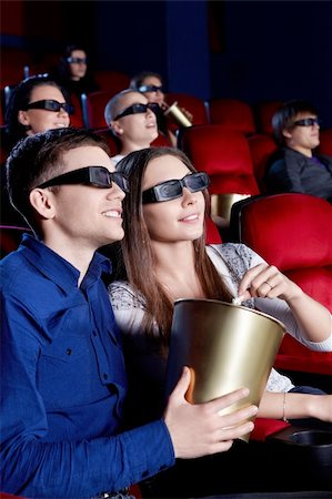 People watch a movie in 3D glasses in the cinema Stock Photo - Budget Royalty-Free & Subscription, Code: 400-06135479