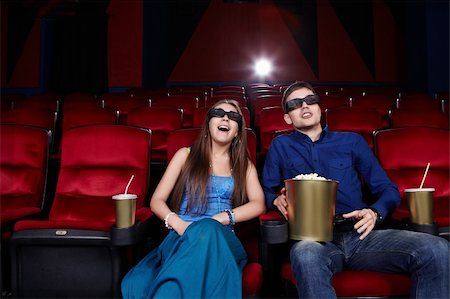 Surprised young couple in a movie theater Stock Photo - Budget Royalty-Free & Subscription, Code: 400-06135472