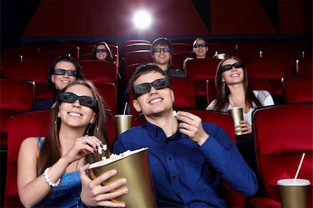 Smiling people in the cinema Stock Photo - Budget Royalty-Free & Subscription, Code: 400-06135473