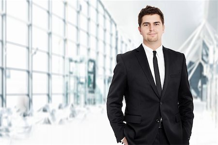 smart models male - A portrait of a young businessman standing over the background of his modern office Stock Photo - Budget Royalty-Free & Subscription, Code: 400-06135581