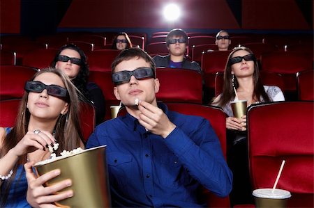 Young people in the cinema in 3D glasses Stock Photo - Budget Royalty-Free & Subscription, Code: 400-06135694