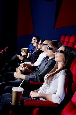 Young people in the cinema in 3D glasses Stock Photo - Budget Royalty-Free & Subscription, Code: 400-06135700