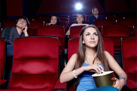 A young girl at the cinema Stock Photo - Budget Royalty-Free & Subscription, Code: 400-06135717