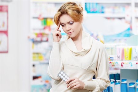 store shelf medicine - The pharmacist at the pharmacy of pills Stock Photo - Budget Royalty-Free & Subscription, Code: 400-06135732