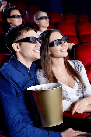 Smiling people in the 3D glasses at the cinema Stock Photo - Budget Royalty-Free & Subscription, Code: 400-06135924